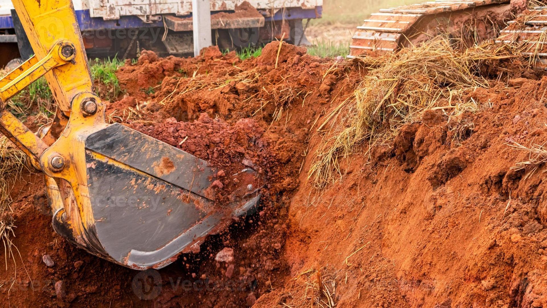 Residential excavation in progress with heavy machinery preparing site for construction