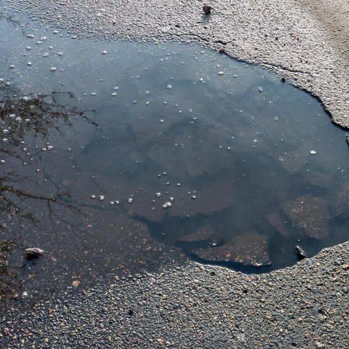 Pothole on Driveway Caused by Pooling Water - Repaired by CM Ayres Enterprises - 