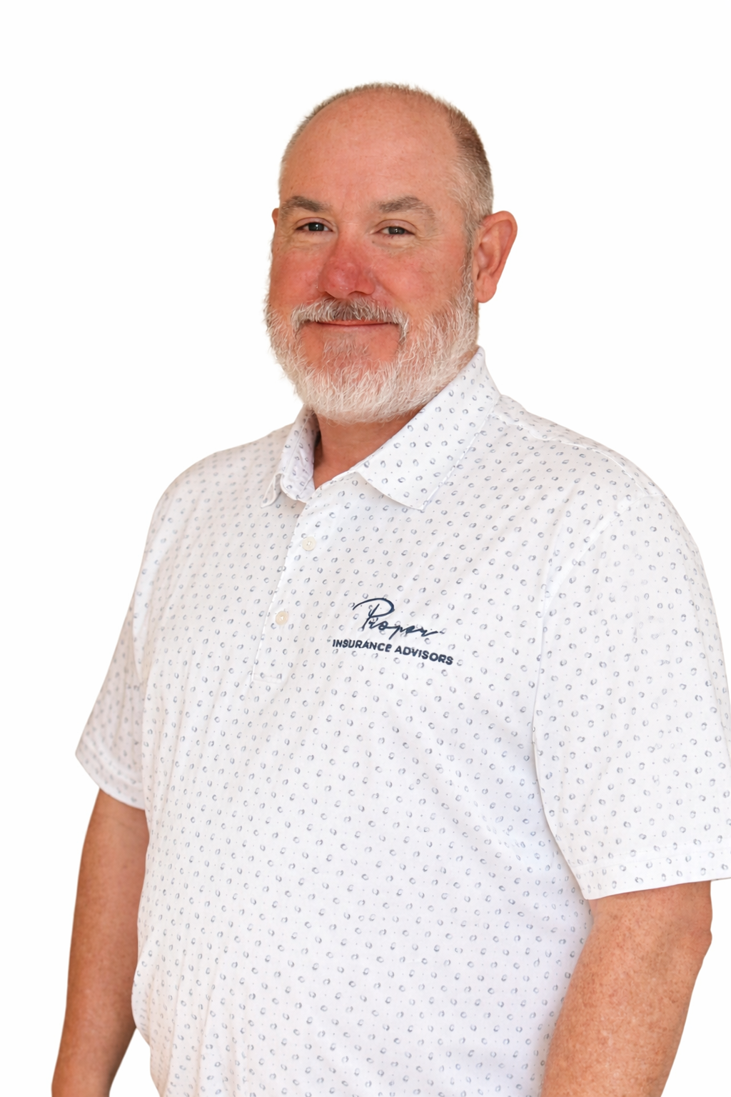 Man with a gray beard wearing a white polo shirt with the company logo, smiling.