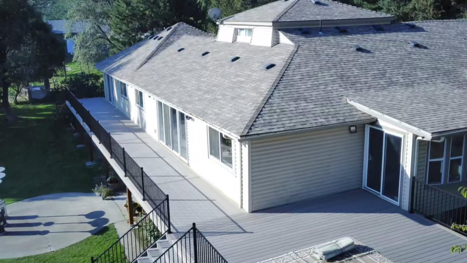 a deck with a circular pool inside it