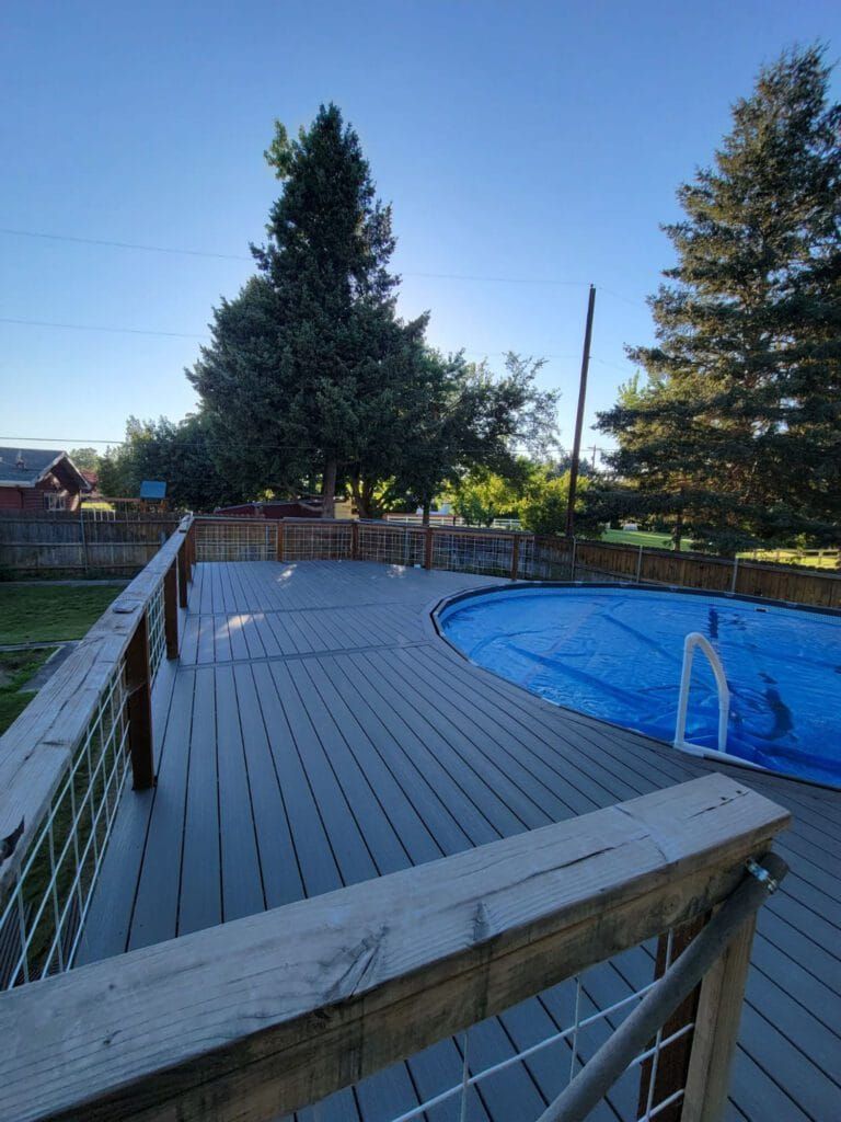 a deck with a circular pool inside it