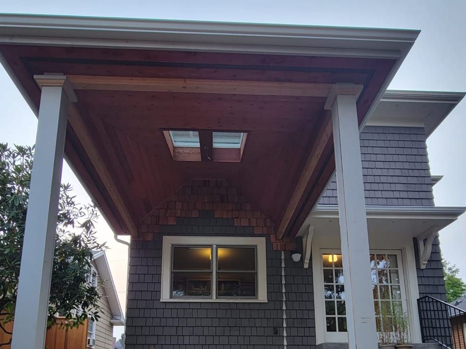 the underside of a reddish wood patio cover