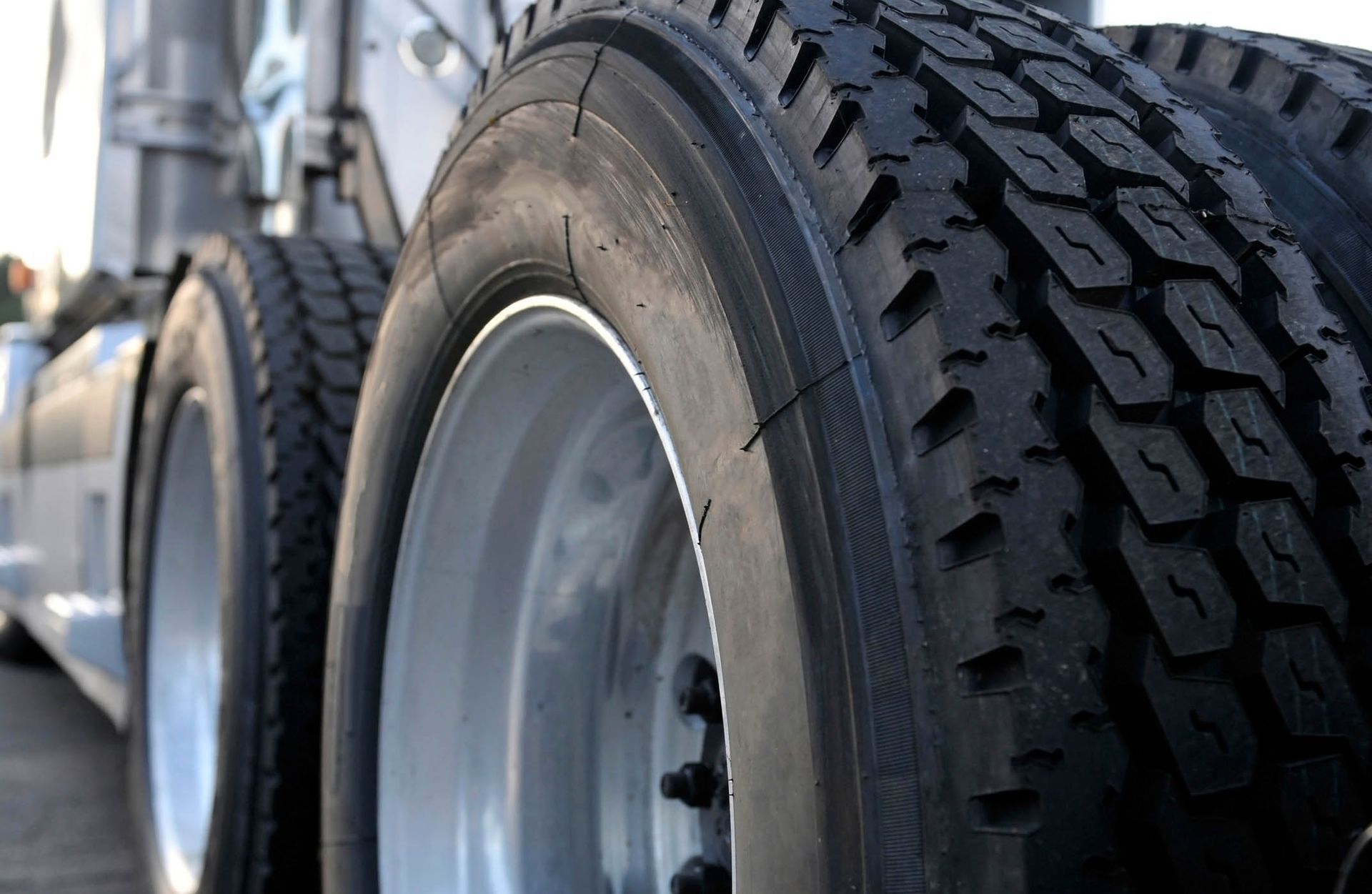 A close up of a truck 's tires and wheels