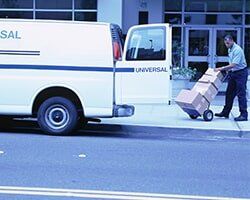 Loading Parcels into Van - Insurance Agency in Artesia, NM