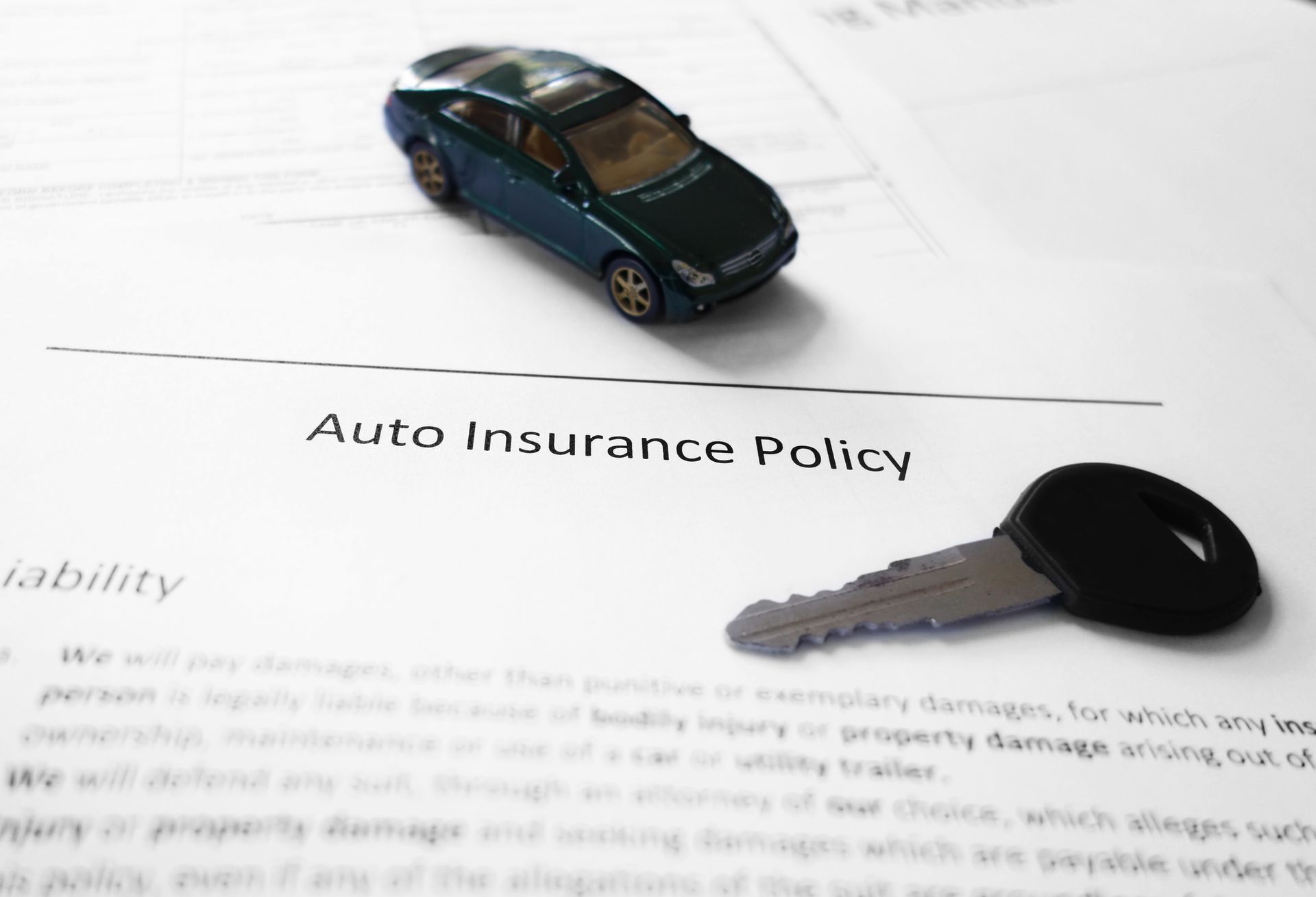 George Gandy Insurance auto policy form detailing factors affecting auto insurance coverage rates in