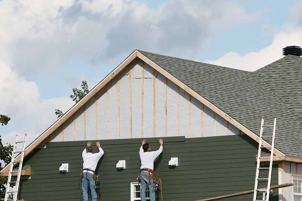 Two Man Installing Covers — Goldsboro, North Carolina — Williams Home Center