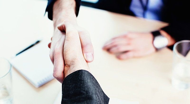Lawyer and Client Shaking Hands — Perth, WA — Peter J. Griffin & Co