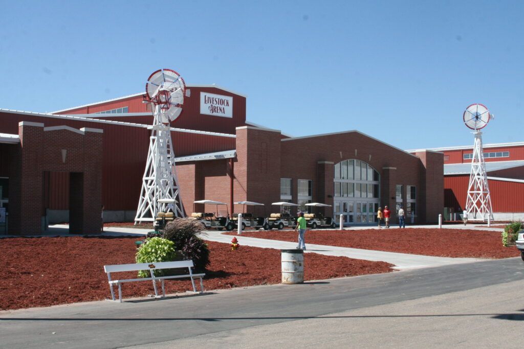 A large brick building with a windmill in front of it
