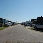 A row of rvs parked on the side of a road.