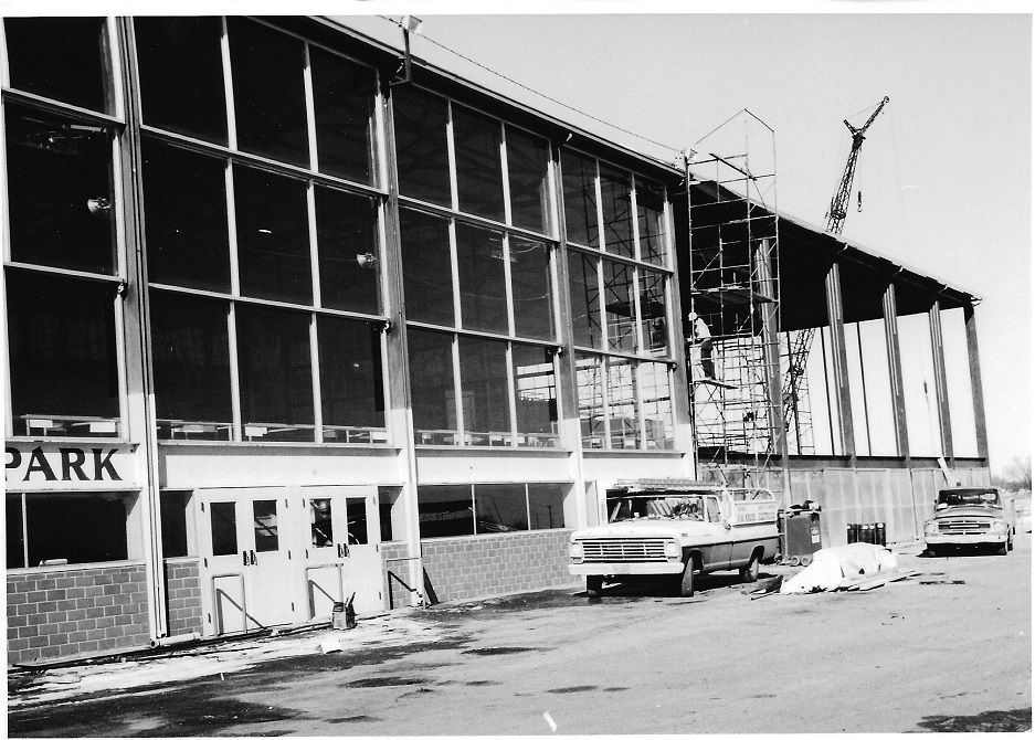 A black and white photo of a building that says park
