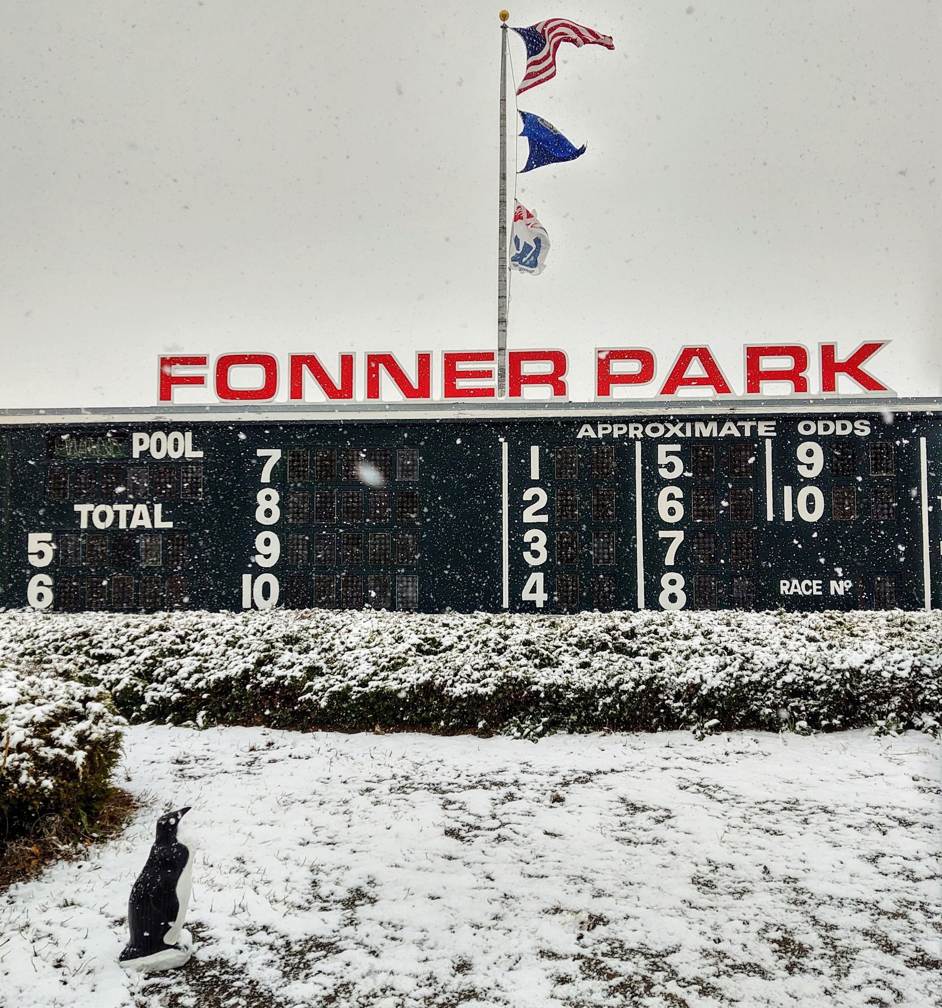 The scoreboard at fonner park is covered in snow