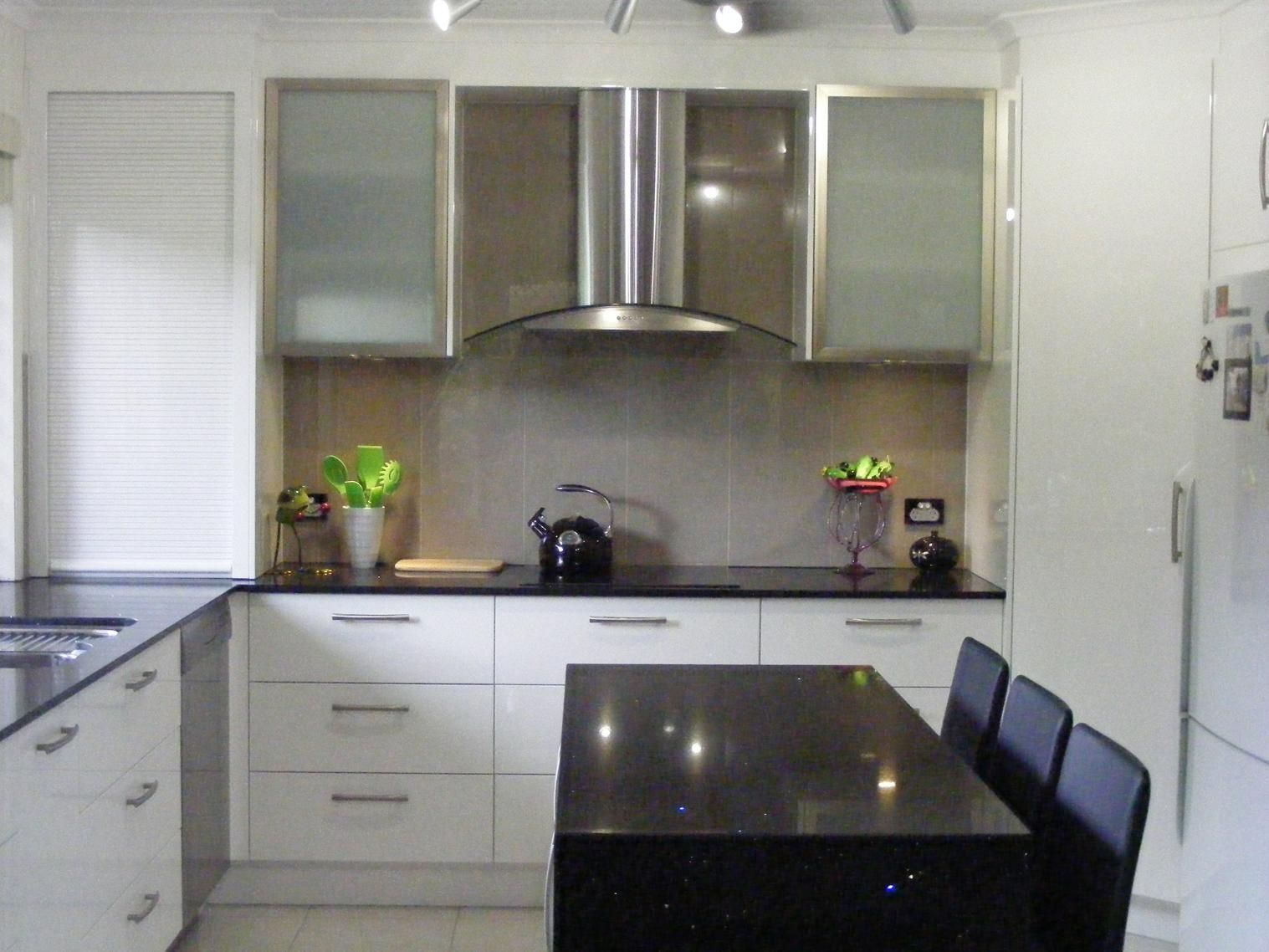 Kitchen With White Cabinets and Black Counter Tops — Advance Kitchens in Sunshine Coast, QLD