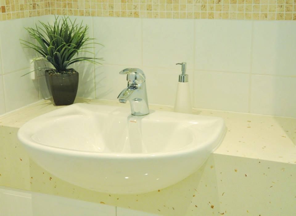 Bathroom Sink With a Plant in a Pot Next to It — Advance Kitchens in Landsborough, QLD