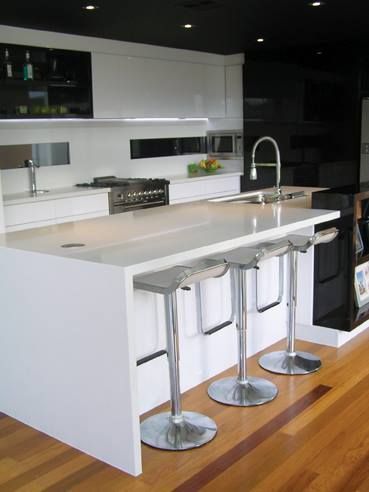 Kitchen With a Large Island and Stools — Advance Kitchens in Landsborough, QLD