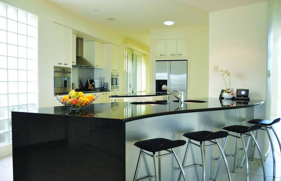 Kitchen With Stools and a Bowl of Fruit on the Counter — Advance Kitchens in Sunshine Coast, QLD