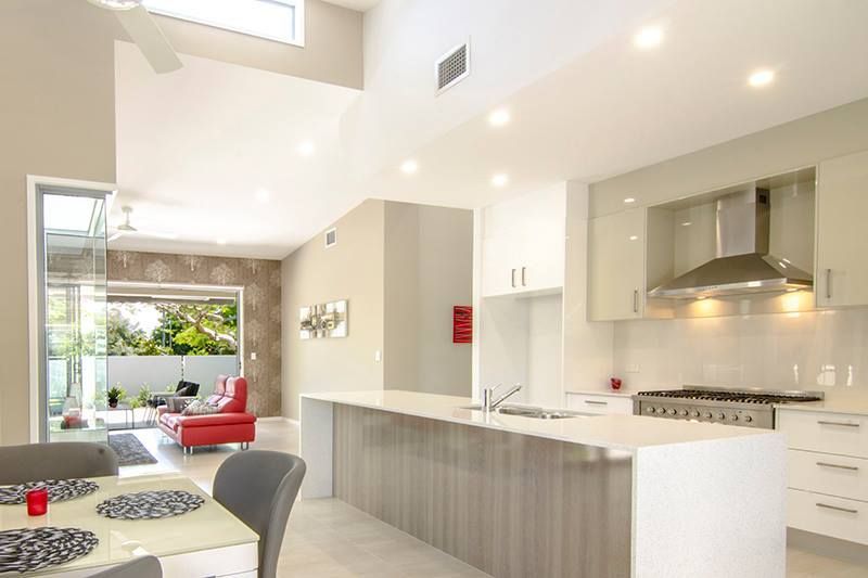 Kitchen With a Table and Chairs in It — Advance Kitchens in Sunshine Coast, QLD