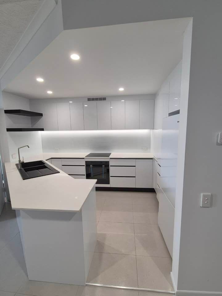 Kitchen With White Cabinets, a Sink, and a Stove — Advance Kitchens in Beerwah, QLD