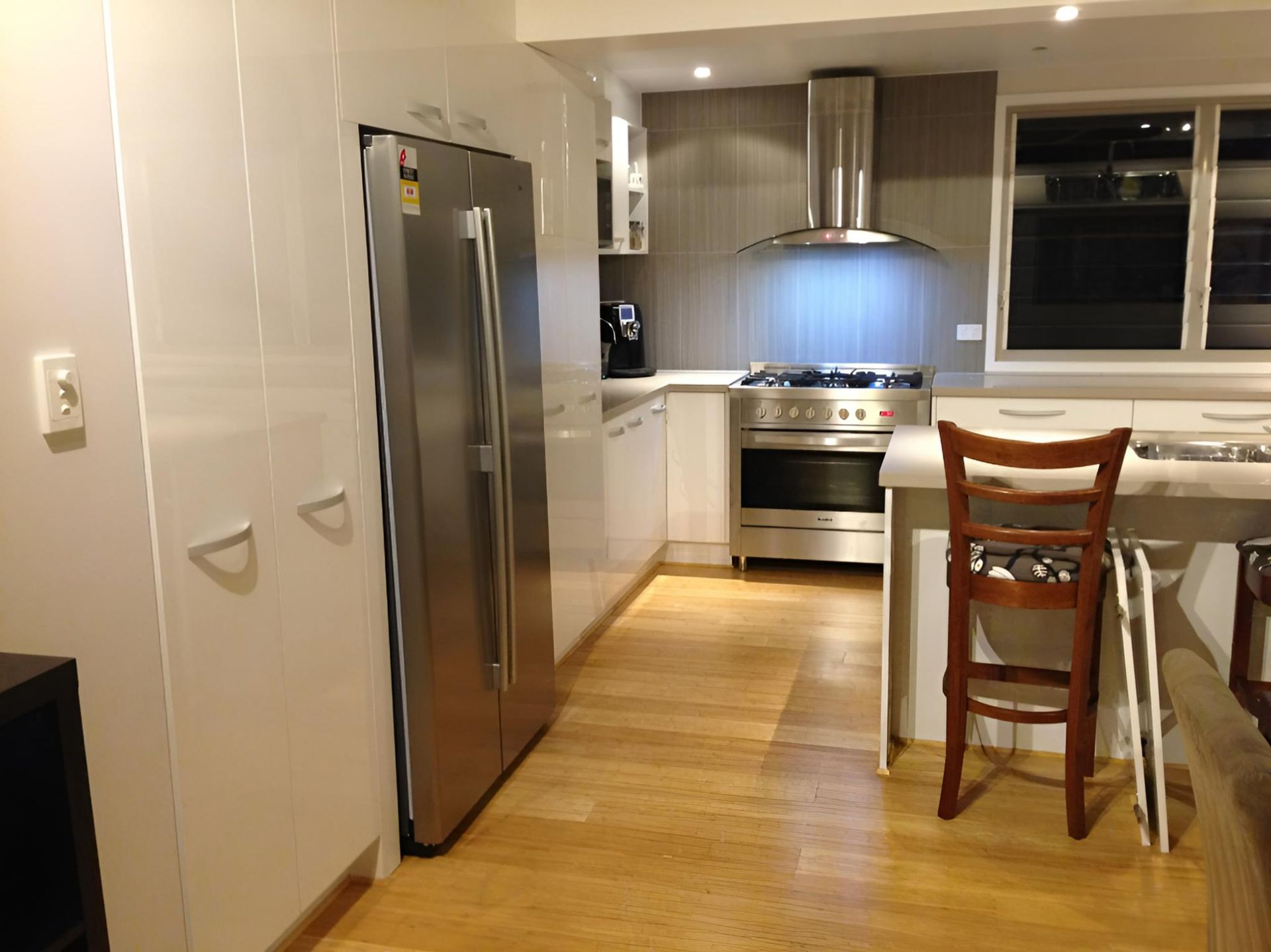 Kitchen with Stainless Steel Appliances and White Cabinets — Advance Kitchens in Caloundra West, QLD