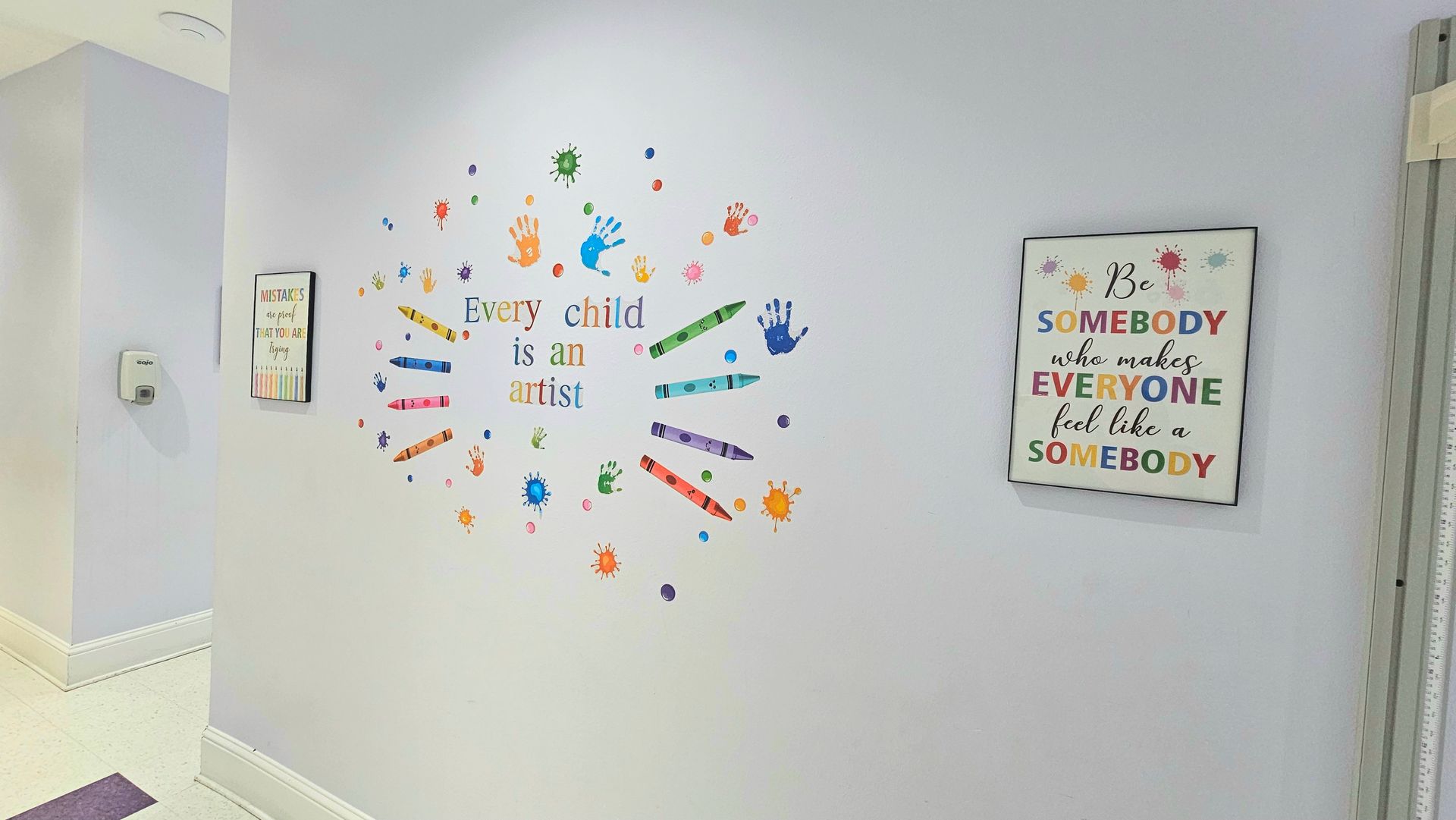 Purple hallway with wall art: 