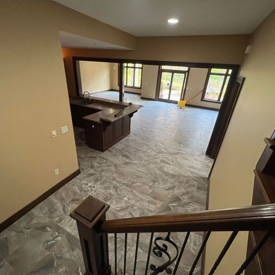 A view of a living room from the second floor of a house.