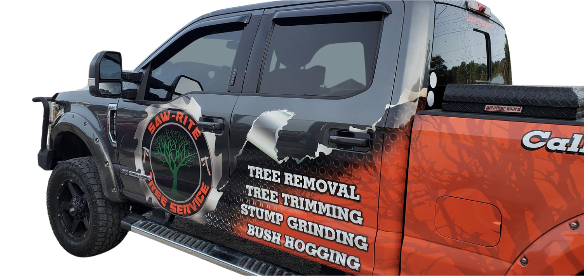 A truck with a tree removal advertisement on the side of it.