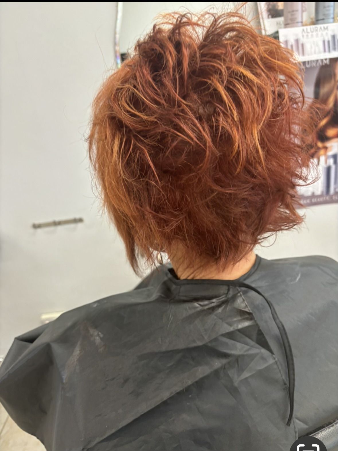 A Woman With Long Red Hair after razor cutting — Janine Wellings Hair Art In Belmont, NSW