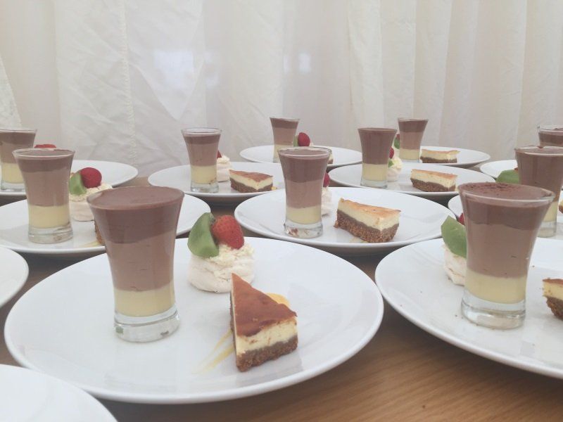 A bunch of plates with desserts on them