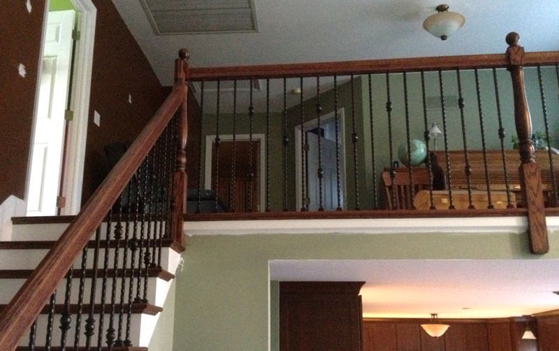 Stairs leading up to a balcony in a house