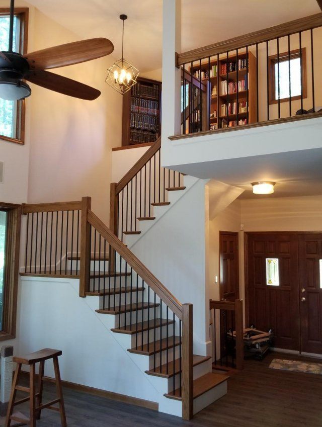 A staircase in a house with a ceiling fan
