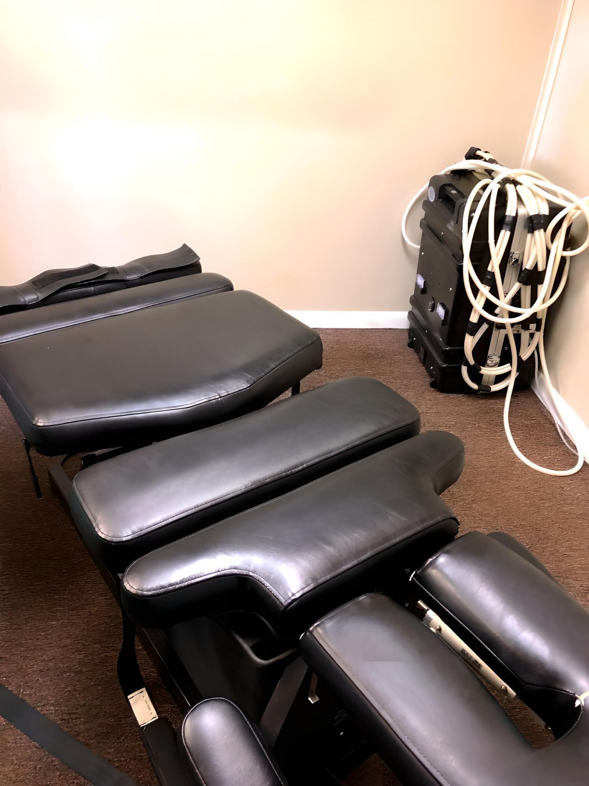 Image of a Chiropractic table and PEMF machine