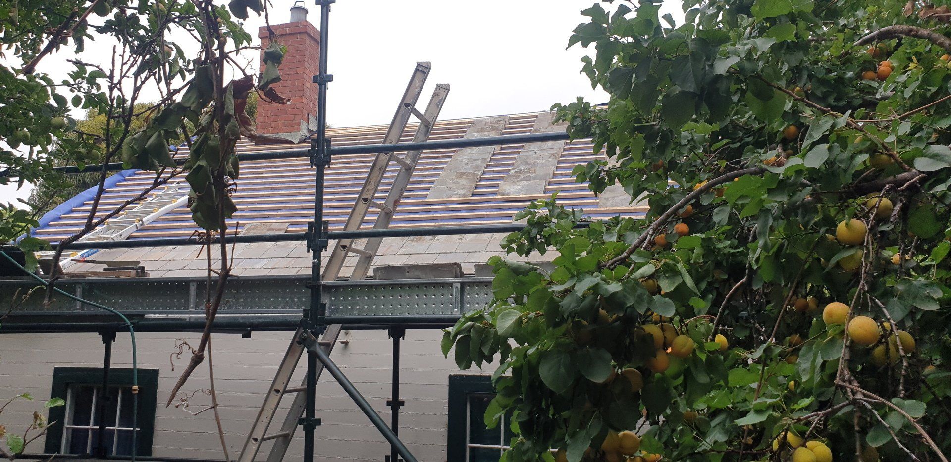 Slate roof on cottage restoration with reclaimed slates