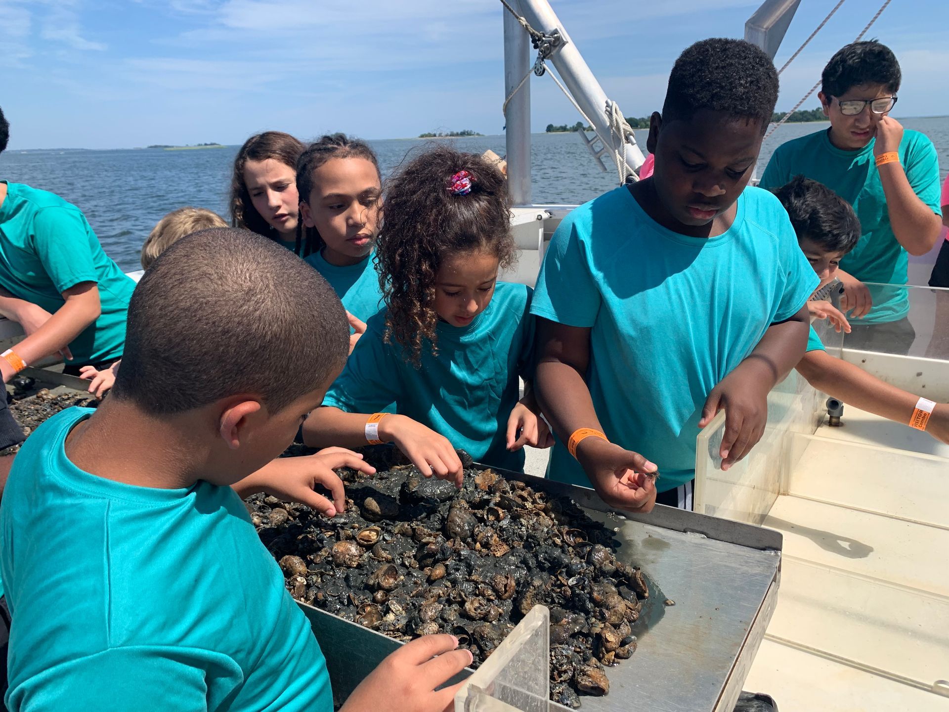 group of kids exploring on a boat