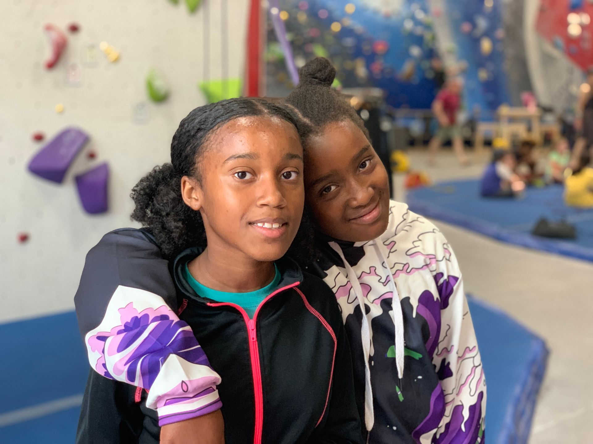 two female campers hanging out at rock climbing venue