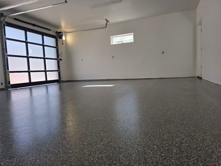 A man is installing an air conditioner on the side of a building.