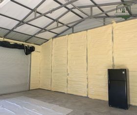 There is a refrigerator in the middle of the room.