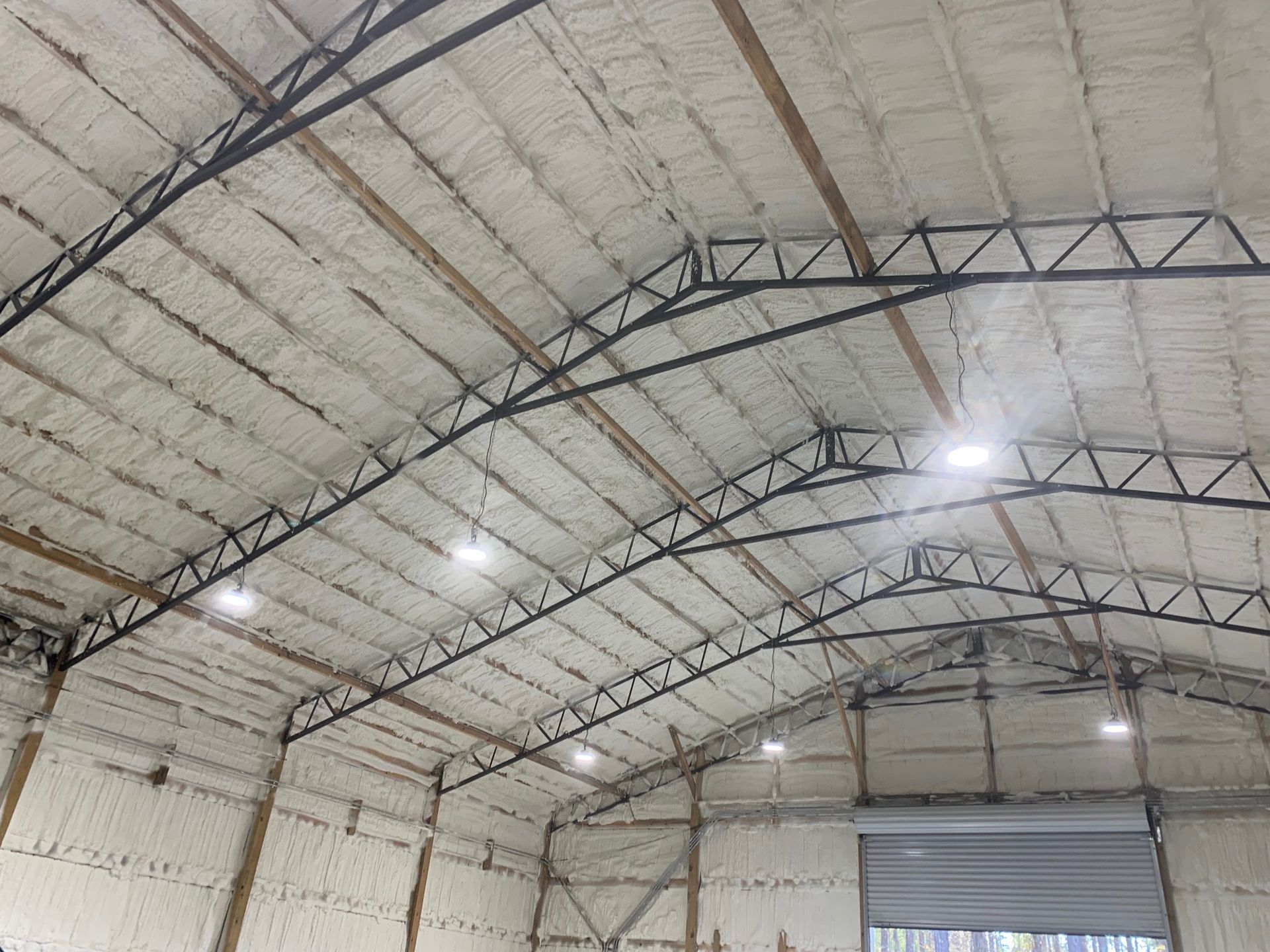 The inside of a large warehouse covered in foam.