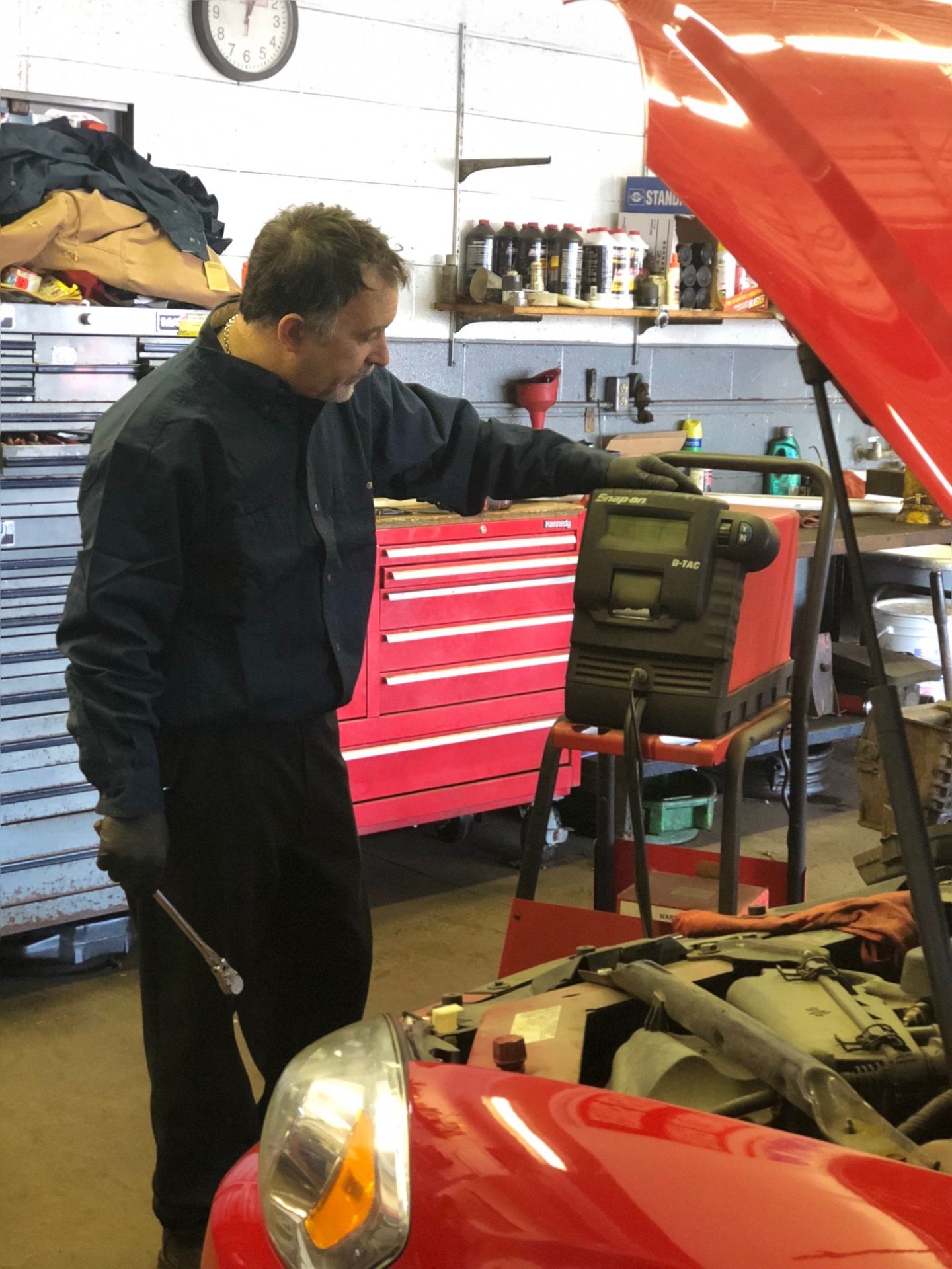 Engine Diagnostics—Mechanic checking transmission of a car in Fraser, MI