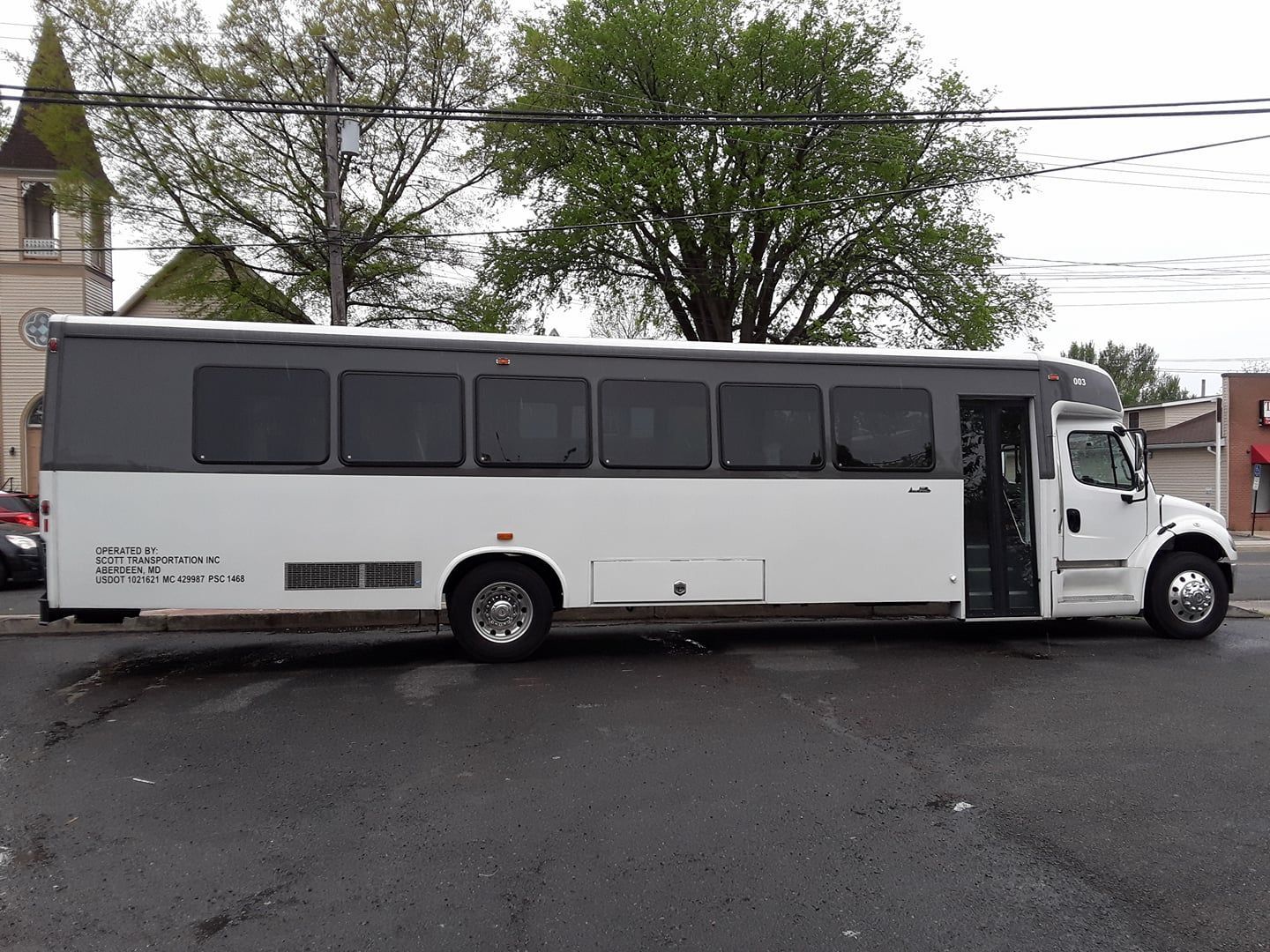 A silhouette of a person with their arms in the air