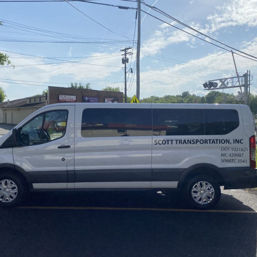 A group of women are sitting in a limousine holding champagne glasses.