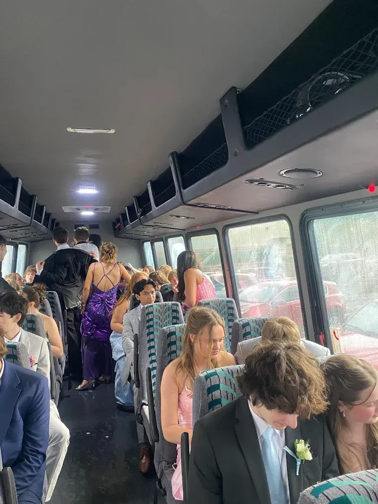 A group of people are sitting on a bus.