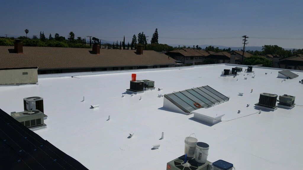 Roof — Huge Commercial Roof With HVAC And Vents in Upland, CA