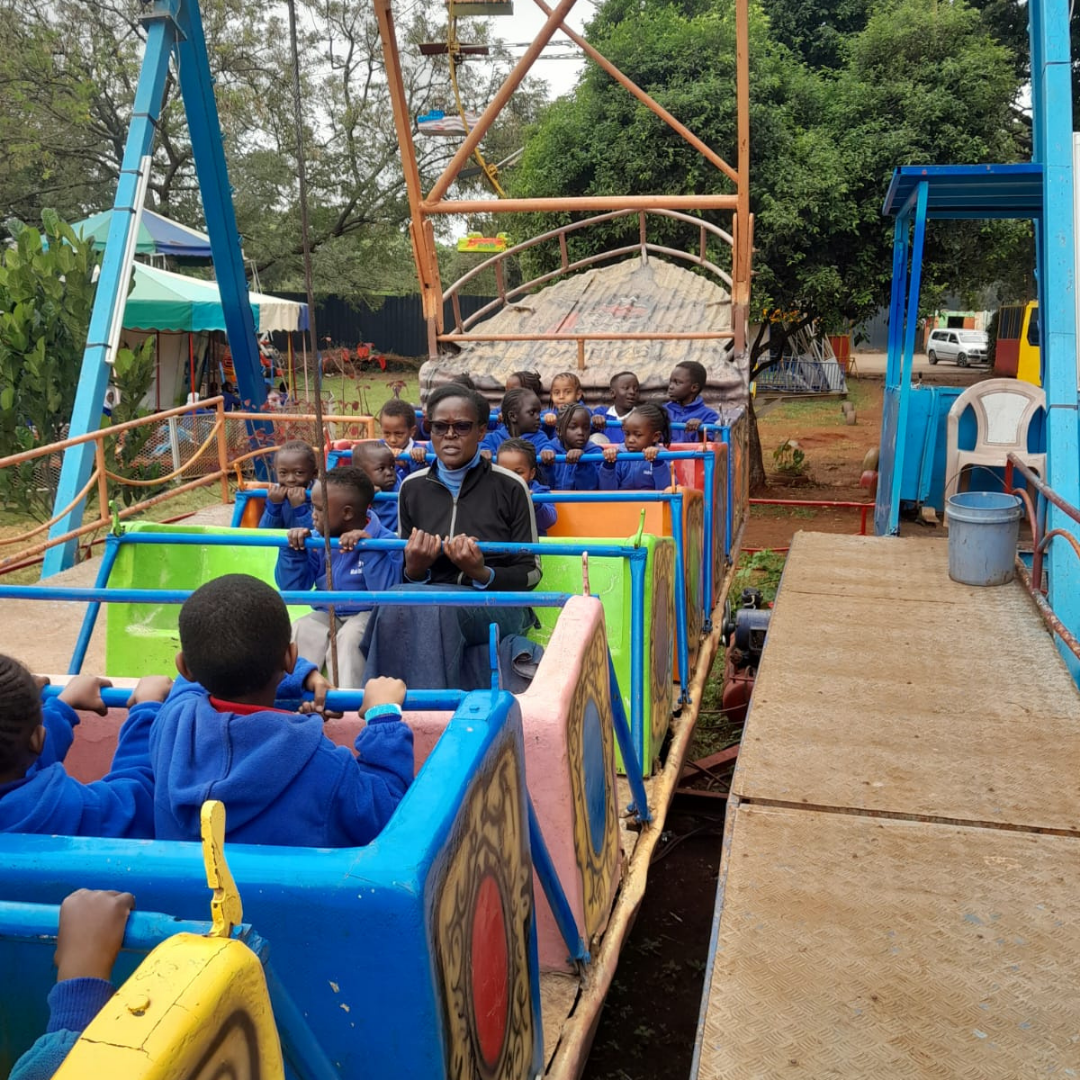 A group of children are riding a ferris wheel
