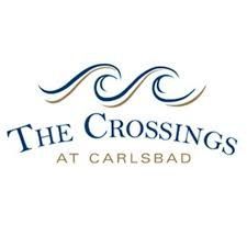Logo: "The Crossings at Carlsbad" with wave design in blue and brown.
