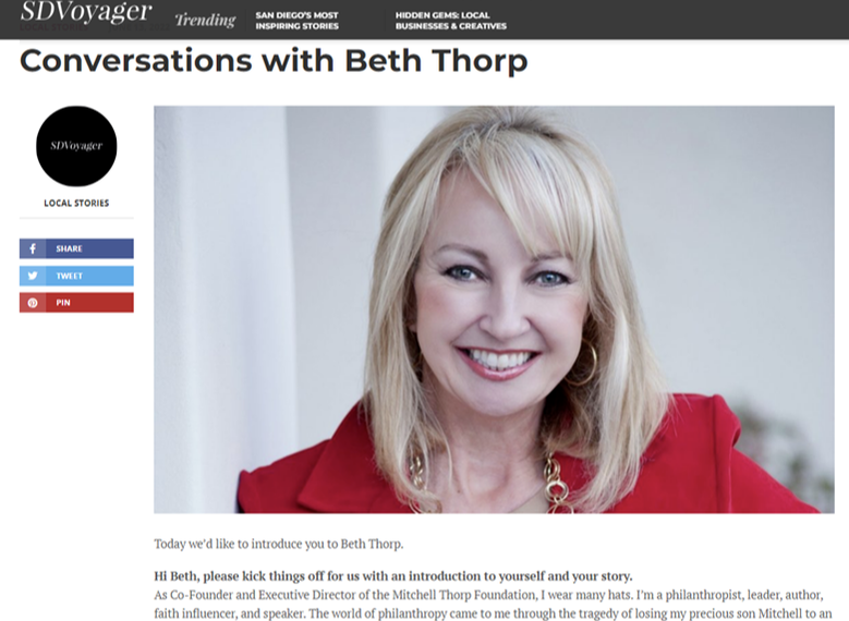 Beth Thorp smiling at the camera, wearing a red jacket. Headline reads, 