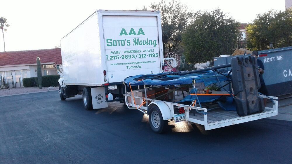 A white truck with the word aaa on the back