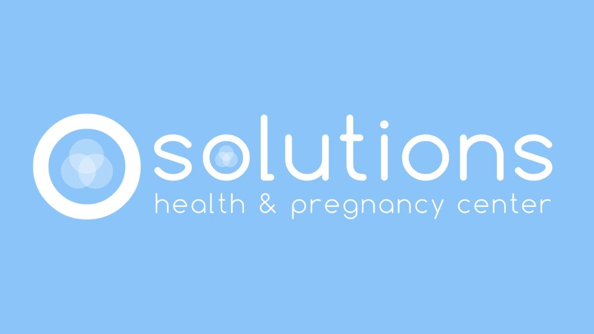 The solution health and pregnancy center logo is on a blue background.