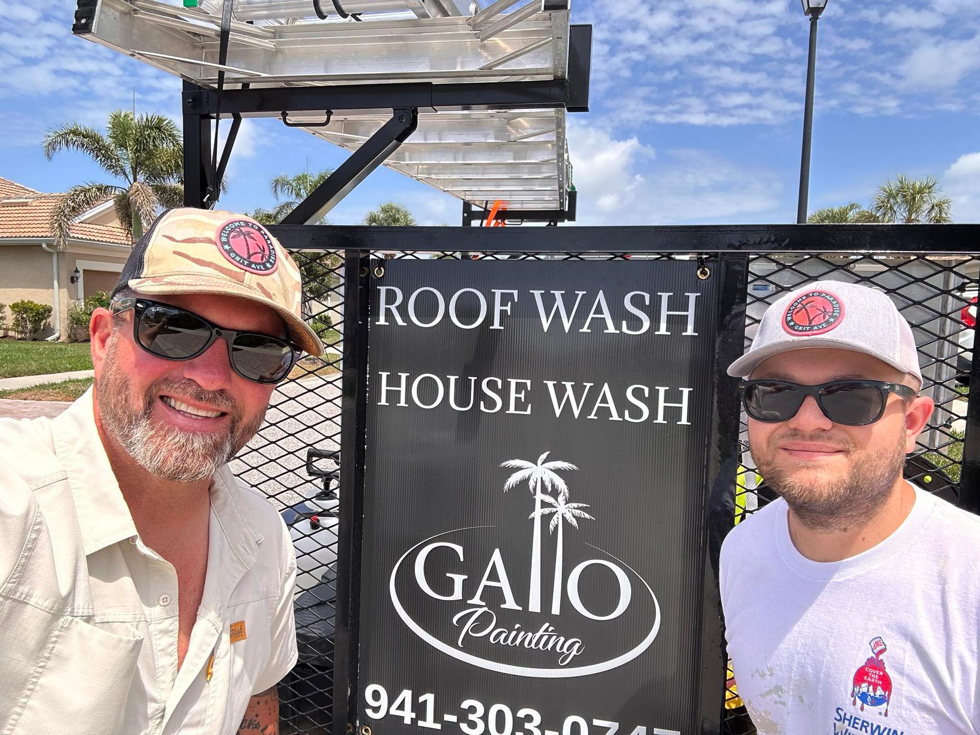 Paint supplies including rollers, paint cans, and brushes on plastic sheeting.