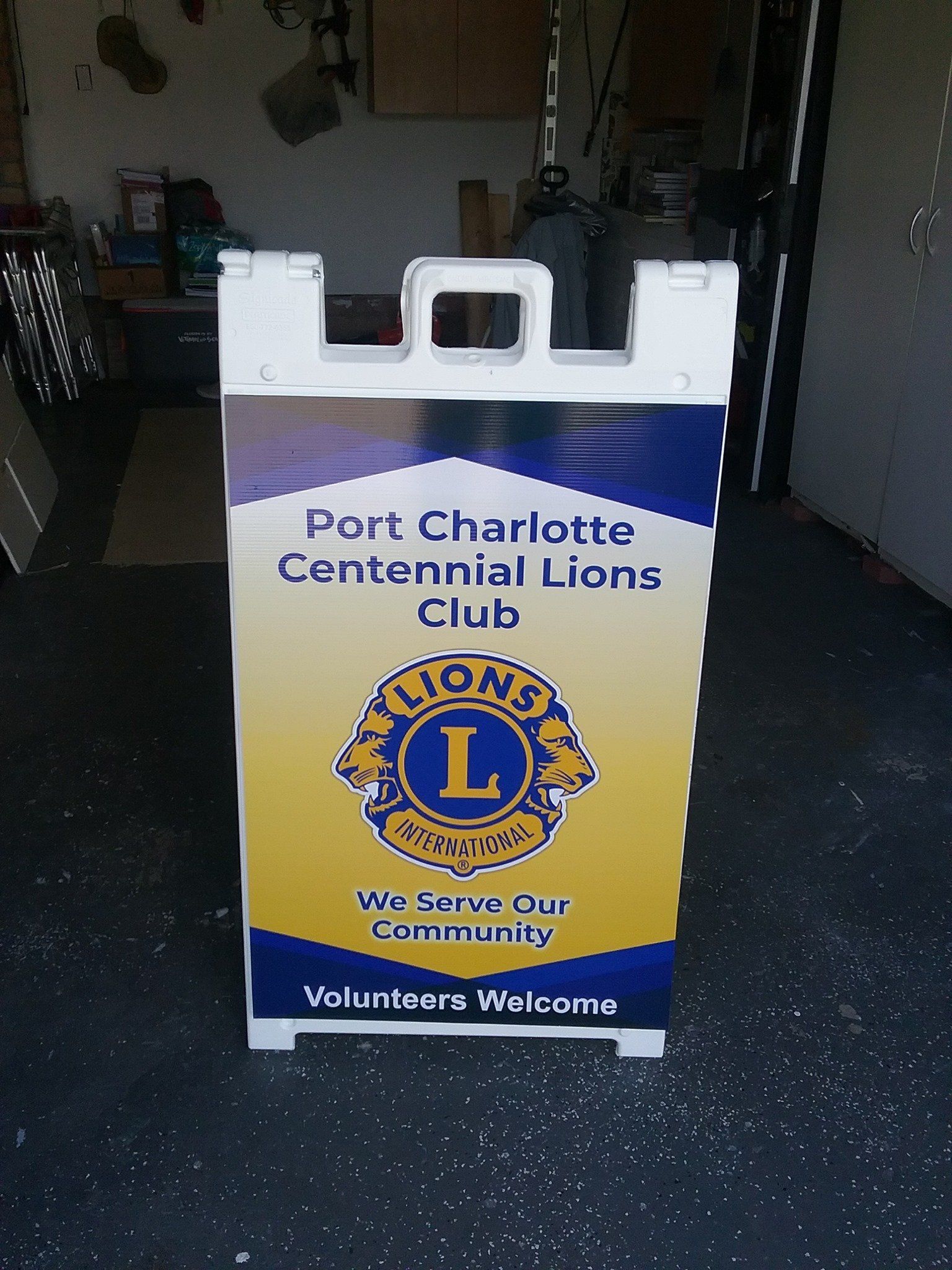 A sign for the port charlotte centennial lions club