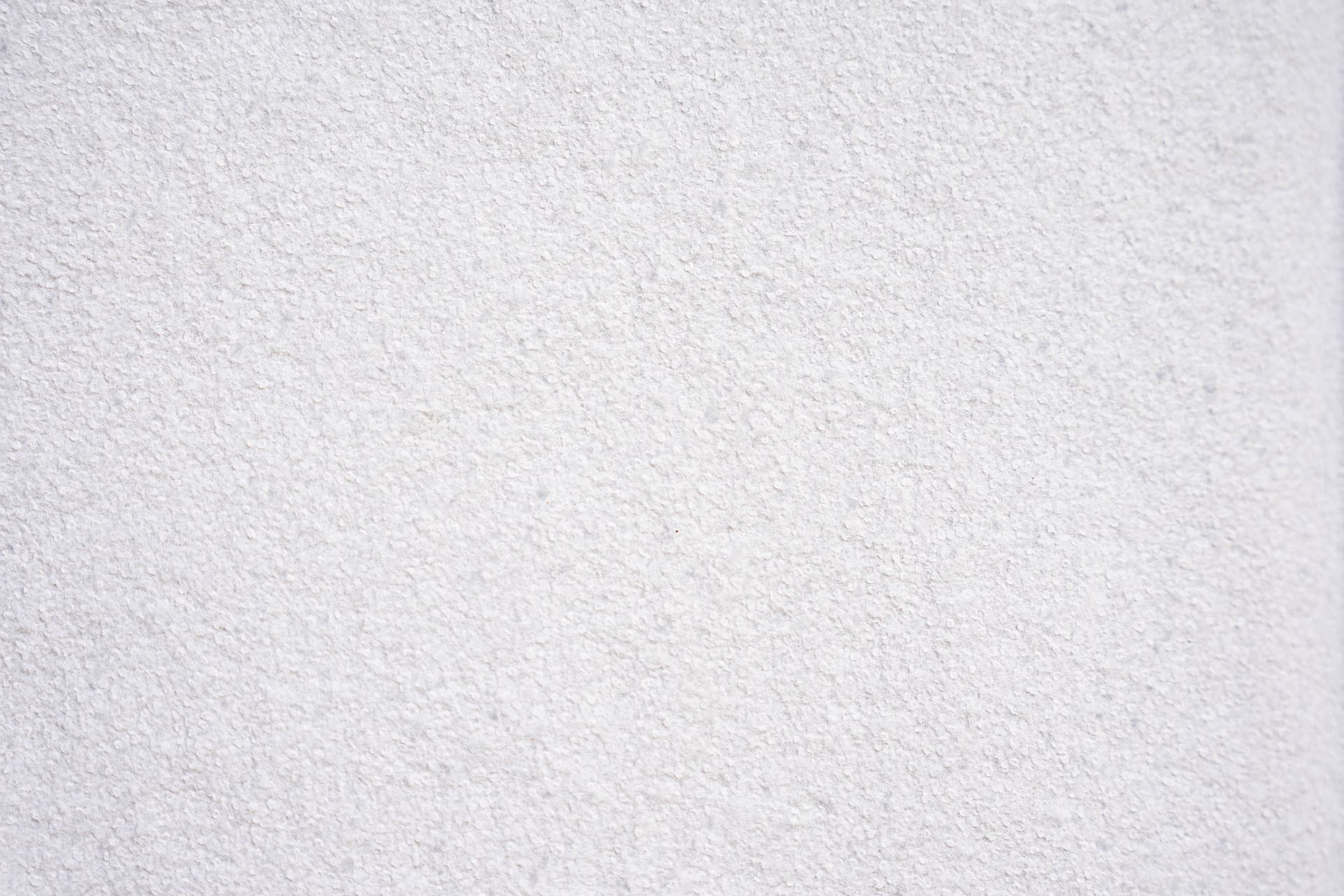 Un primo piano della trama di un tappeto bianco.