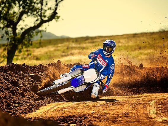 Man In Full Gear Riding A Dirt Bike — Motorcycle Dealer in Berrimah, NT